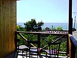 Вид с балкона коттеджа на море